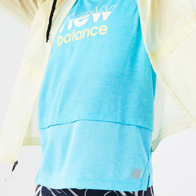 Bright blue tank under the jacket.