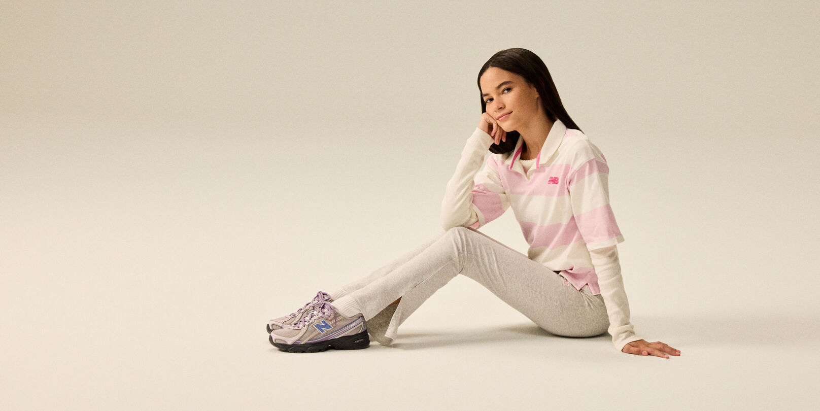 Girl wearing a pair of 740 sneakers.