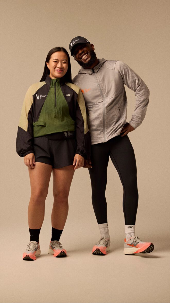 Man and woman wearing New York City Marathon apparel 