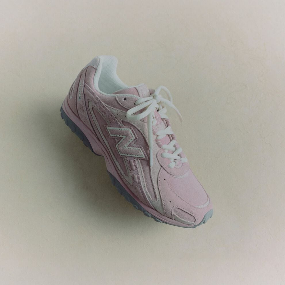 Pink shoe on beige background 