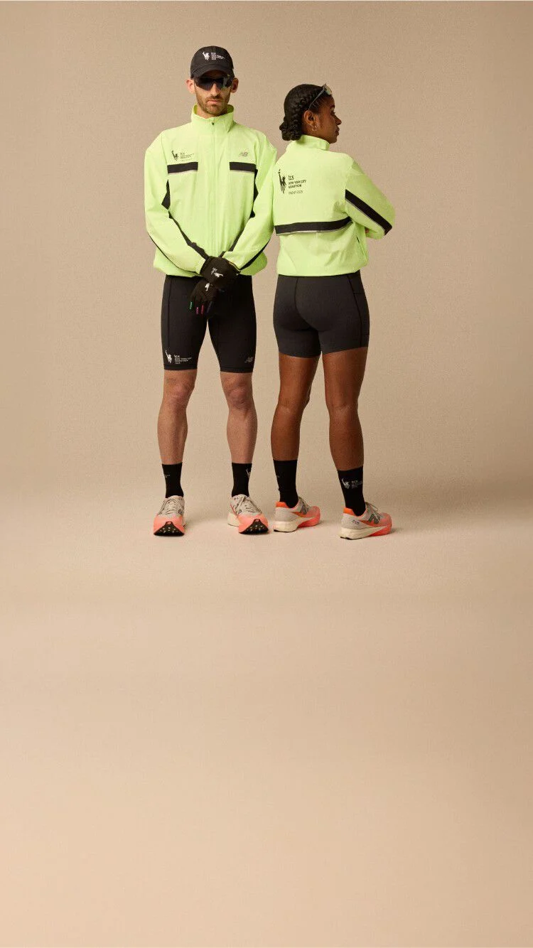 A man and woman wearing neon yellow jacket and running apparel in front of a beige background. 