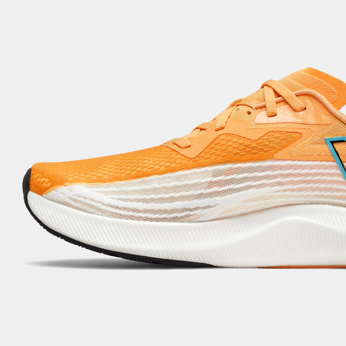 Cropped view of the side of a men’s NB FuelCell Rebel v2 running shoe