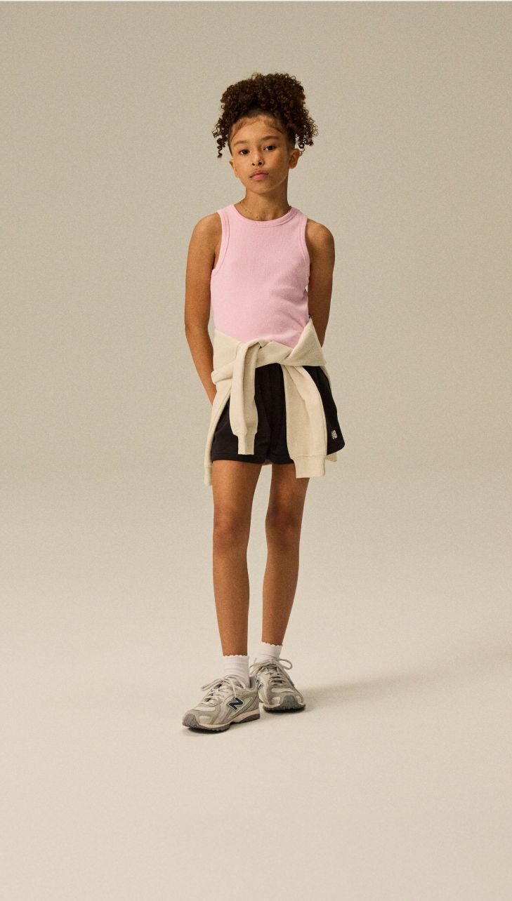 Girl wearing a pair of 204L shoes.