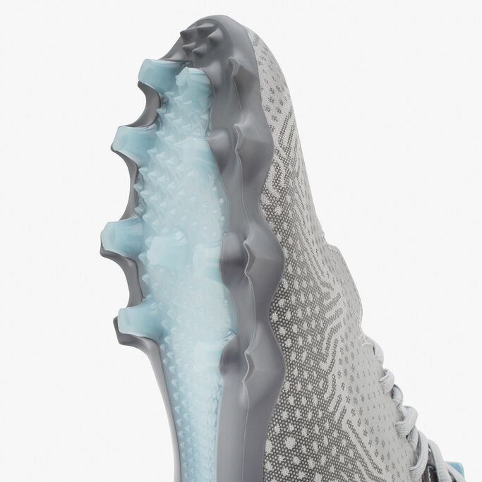 Bottom of the cleat pattern with the toe pointing upwards.