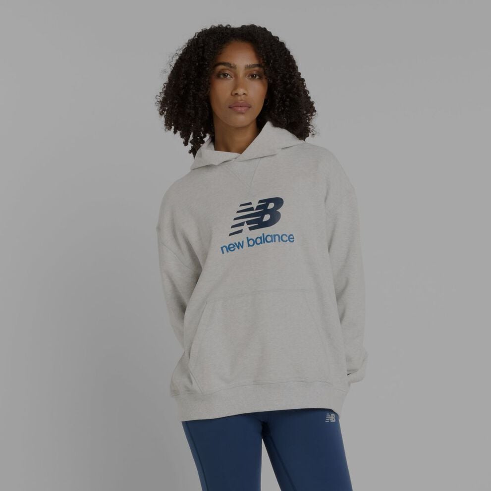 Women in a grey New Balance hoodie.
