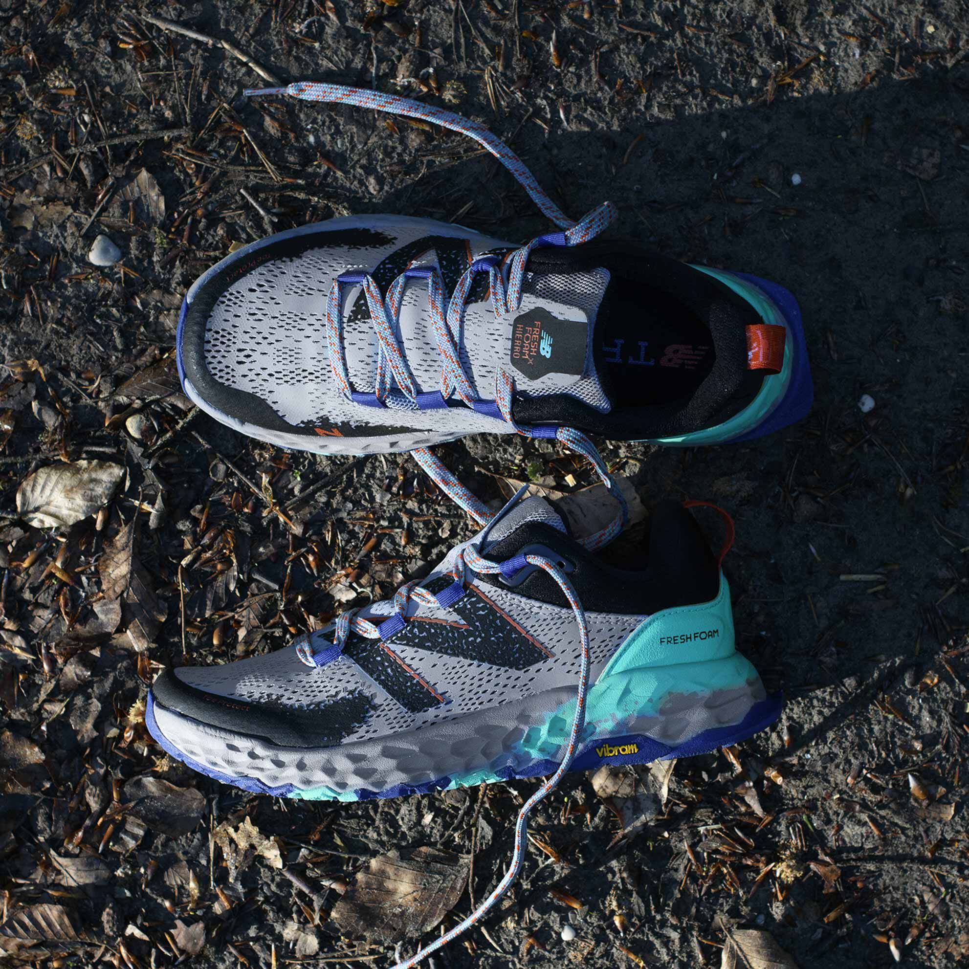 Women’s gray Fresh Foam Hierro trail shoes sitting on trail