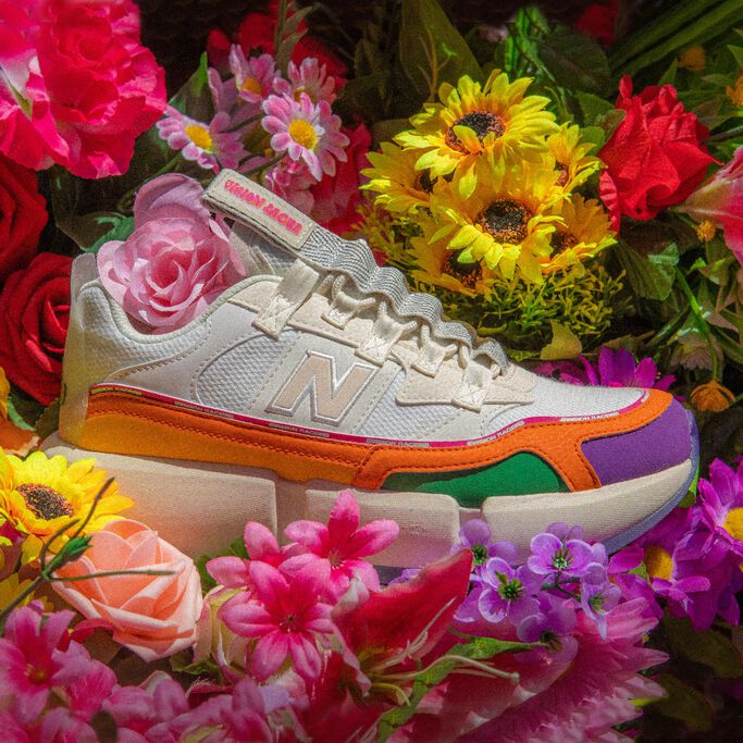 Top-down shot of a white Vision Racer with multiple color accents on a bed of flowers.