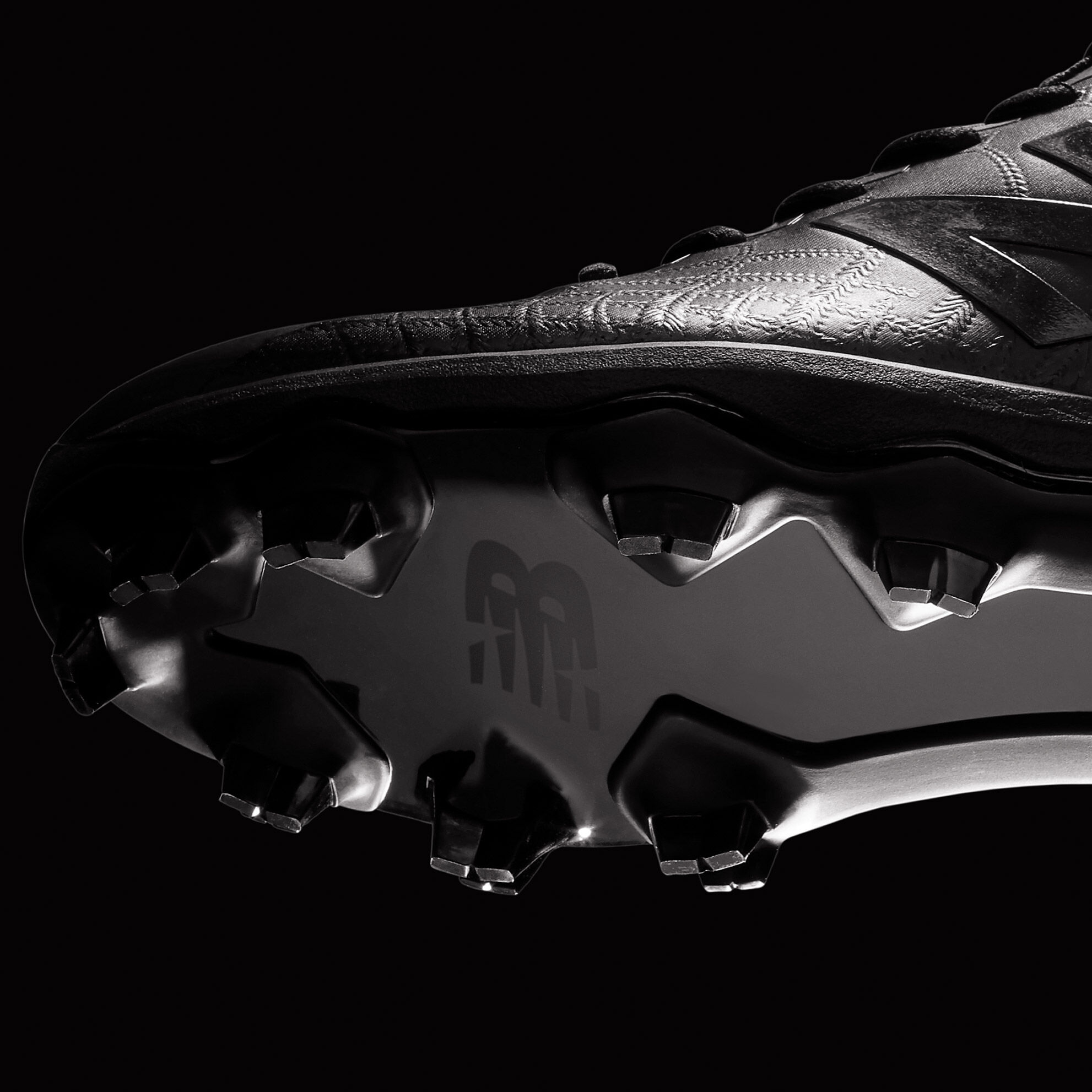 Floating cleat that shows the bottom of the molded spike pattern.