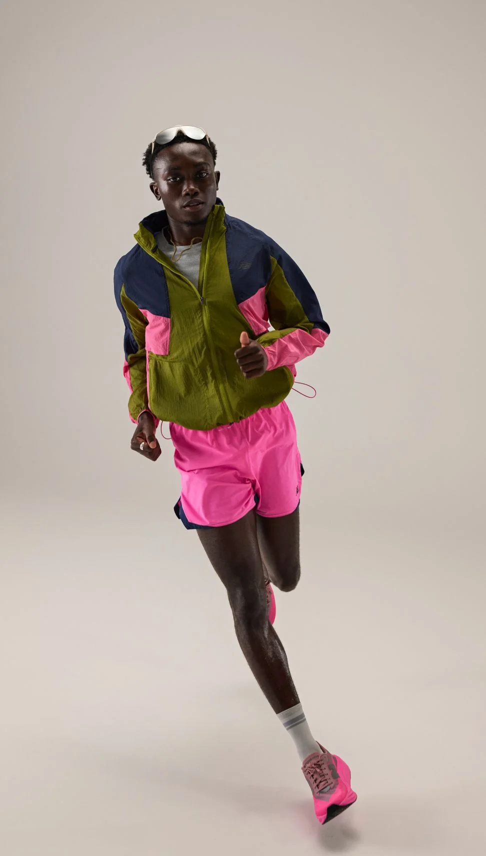 Tinoda Matsatsa running and wearing RC apparel. 