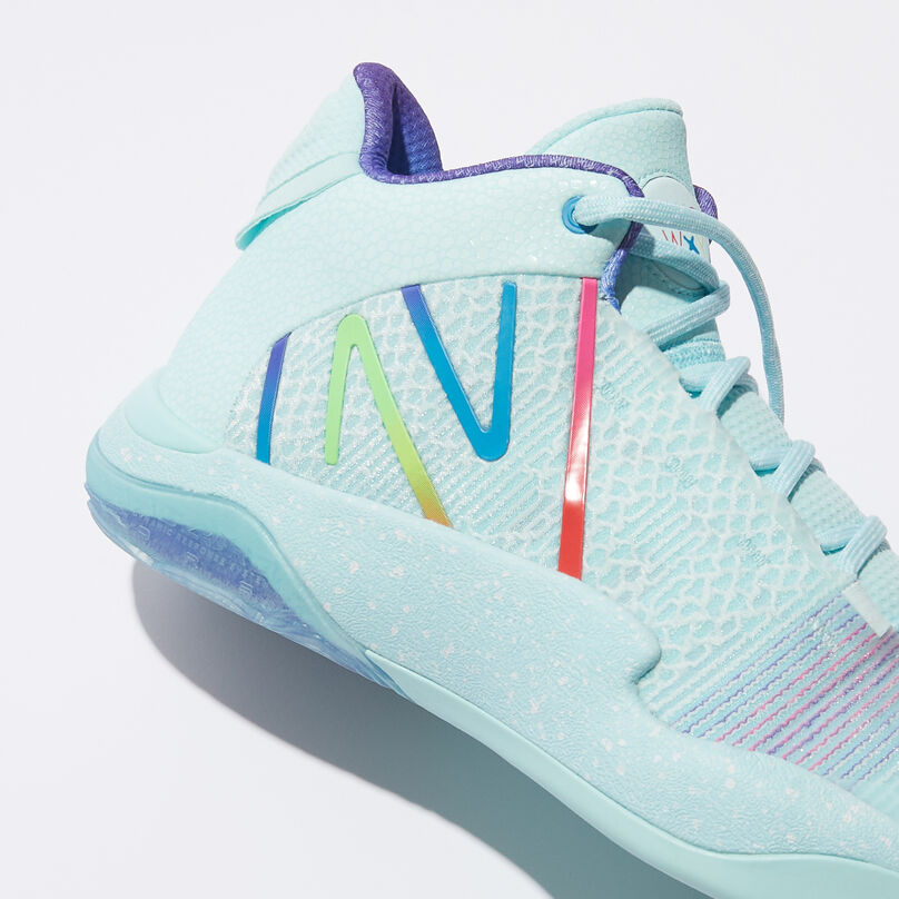 Side profile of the shoe focusing on the large “N” near the heel.