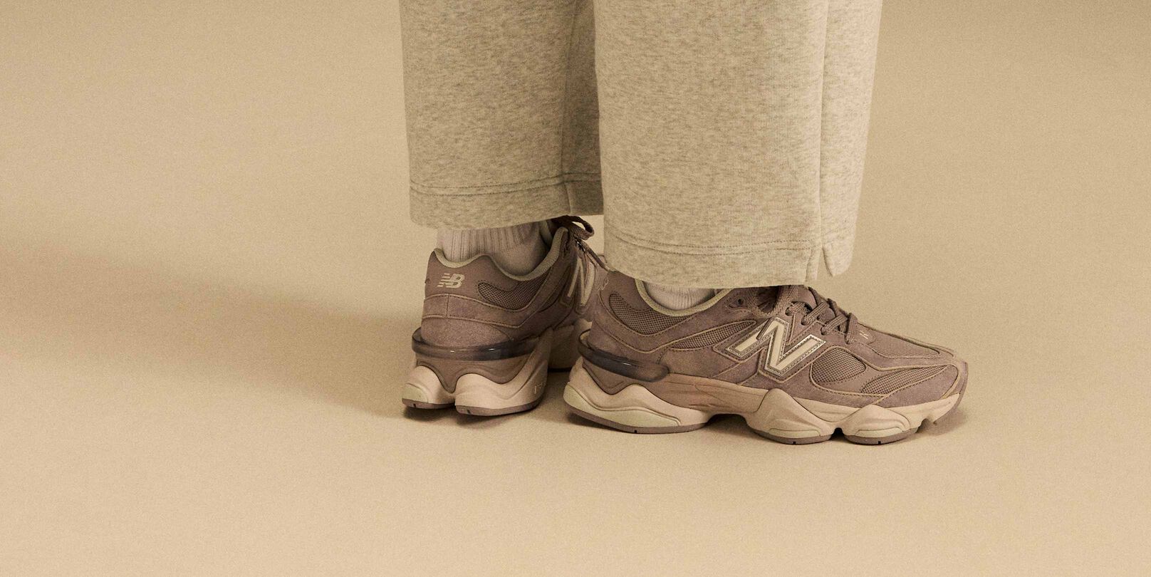 Side profile on-figure shot of the tan and beige shoes.