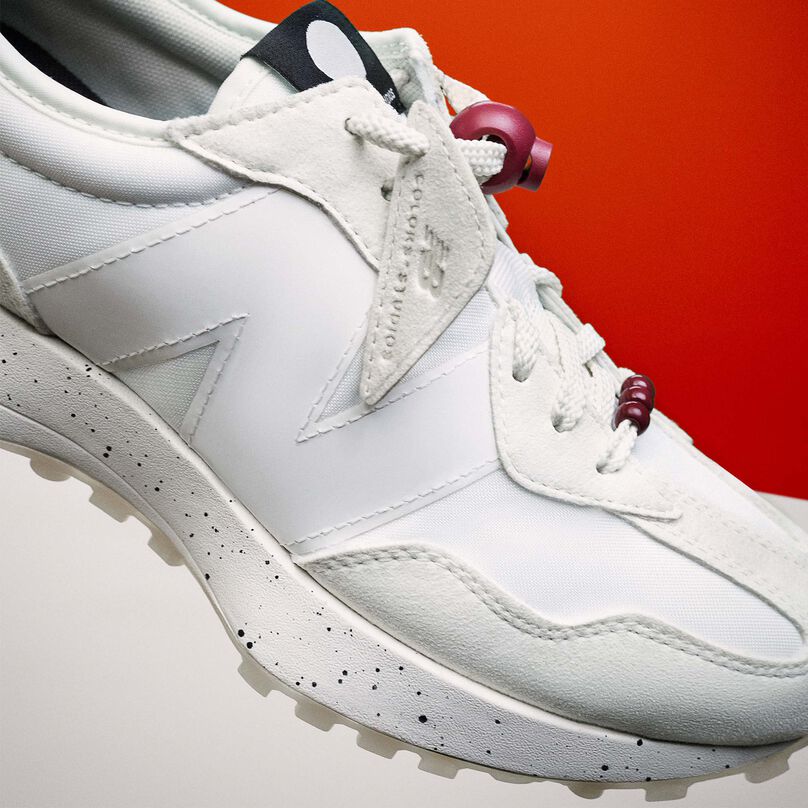 White 327 shoe posed to show detail in lace stopper and lace keeper