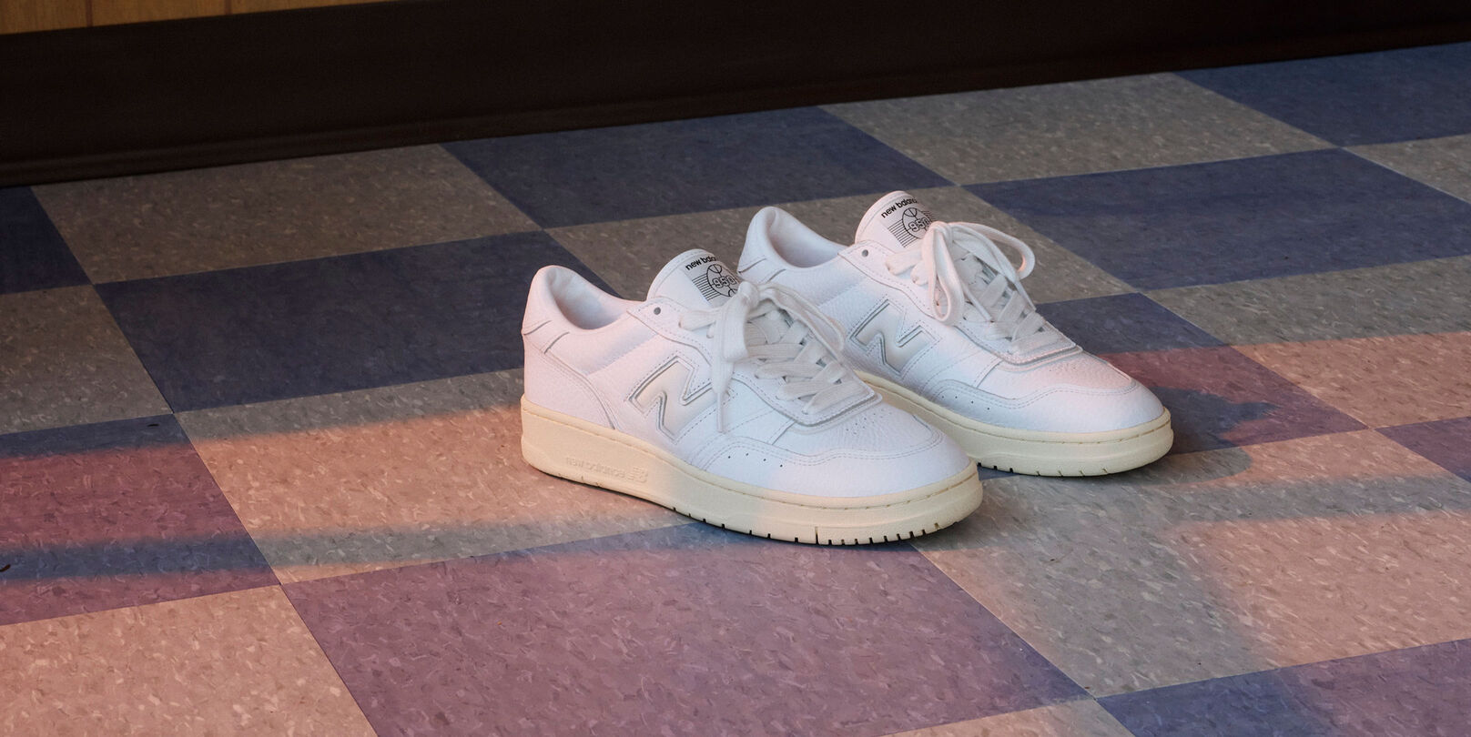 White pair of 950s on a tile floor