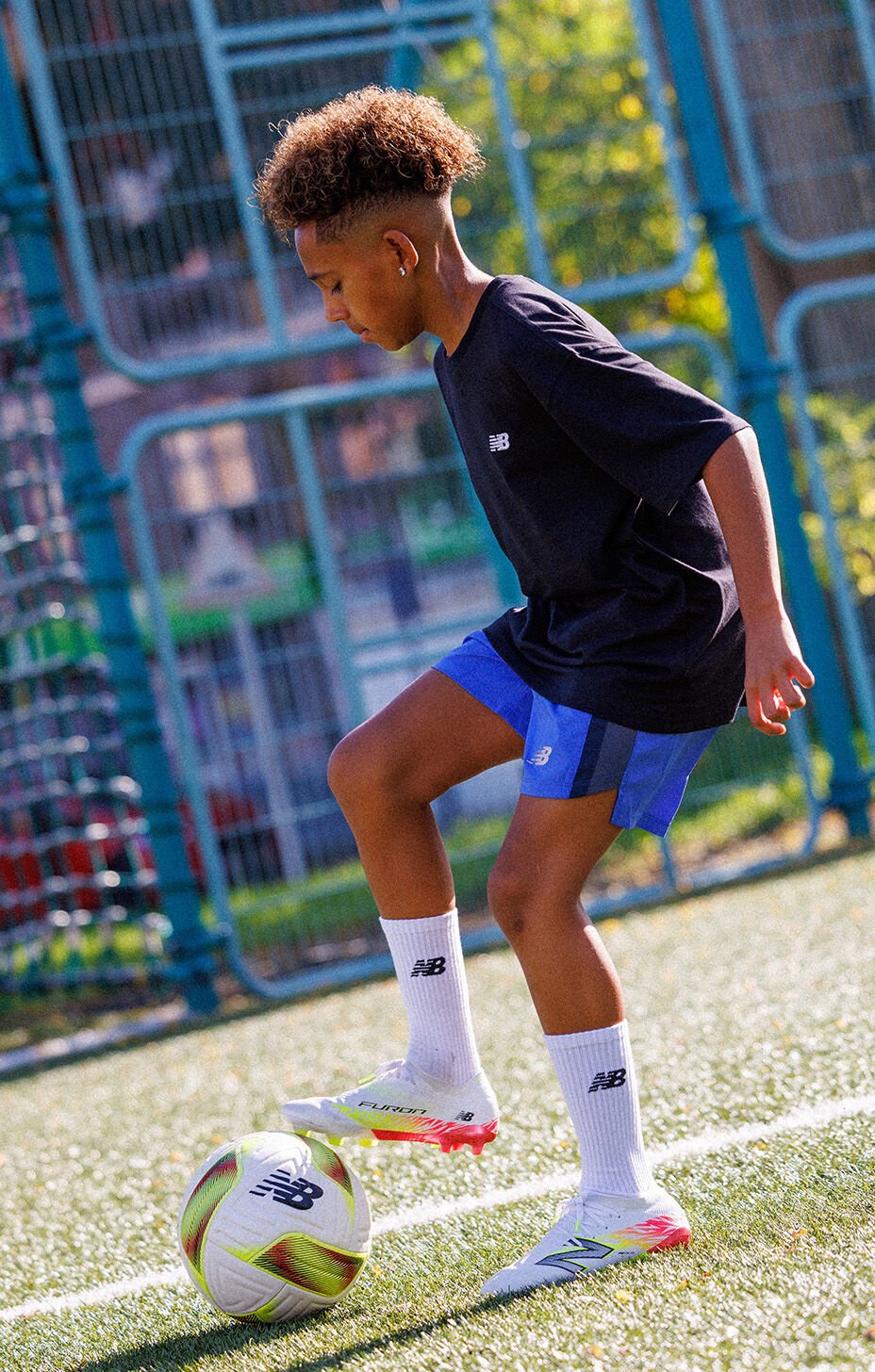 Kid playing soccer.