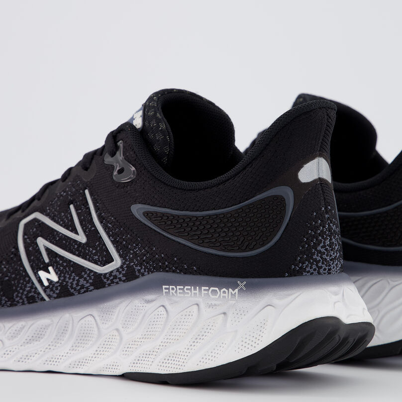Back of the heel of a pair of black running shoes.