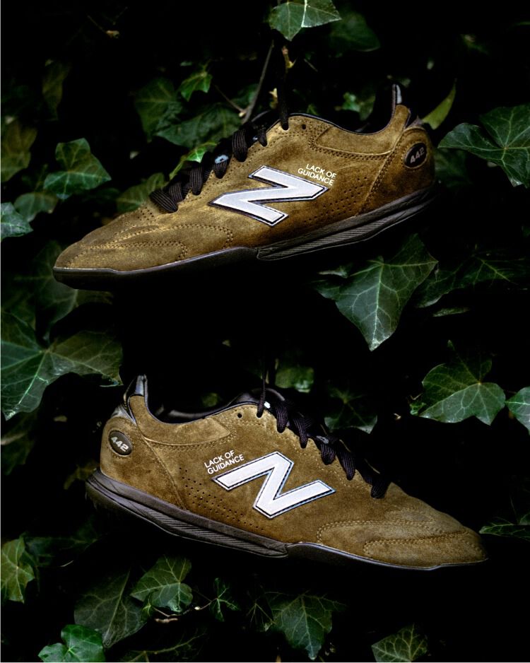 Dark green shoes in a bush.