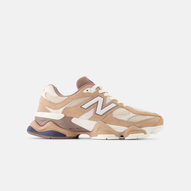 Tan, beige, and white lifestyle shoes. Specifically, the 9060 New Balances.