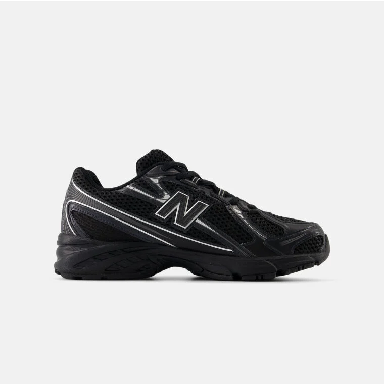Triple black lifestyle shoes with white lines. Specifically, the 740 New Balances.