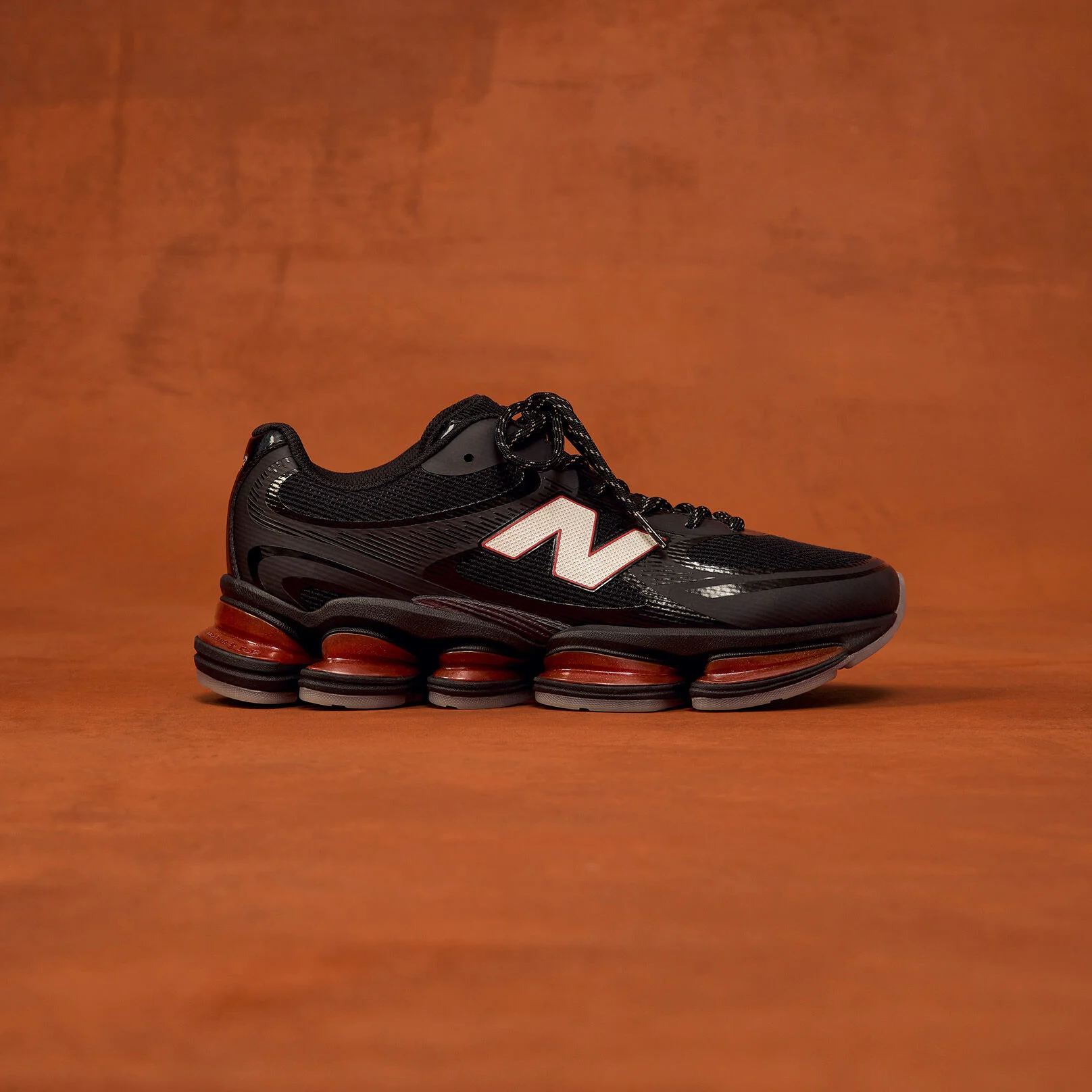 Side profile shot of black shoes with red accents.