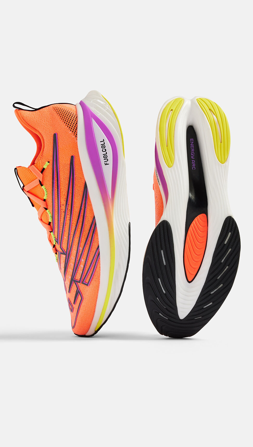 A pair of orange FuelCell SuperComp Elite v3 shoes in studio. 