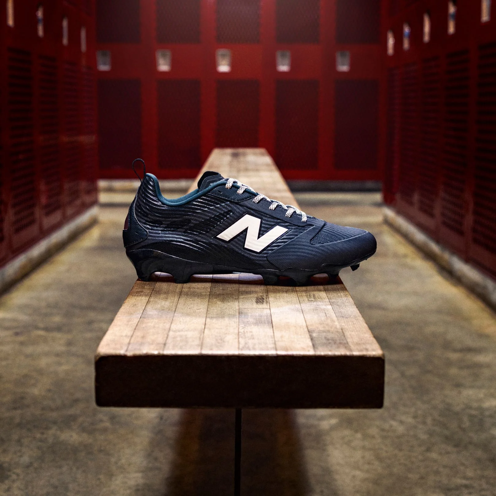 A black Rev iQ cleat in a locker room.
