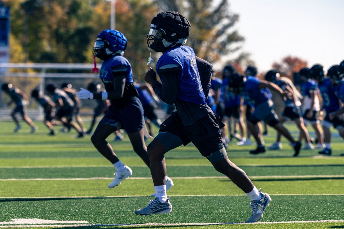 High school football players on a field.