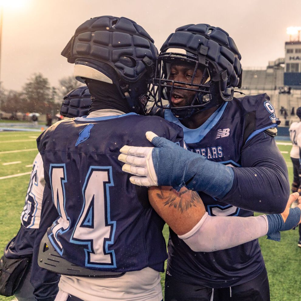 High school football players on a field.