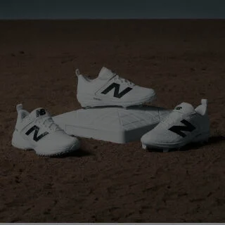 Cleats sitting on a baseball plate and dirt
