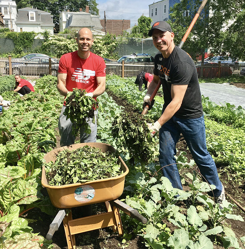 Employees volunteering in community garden