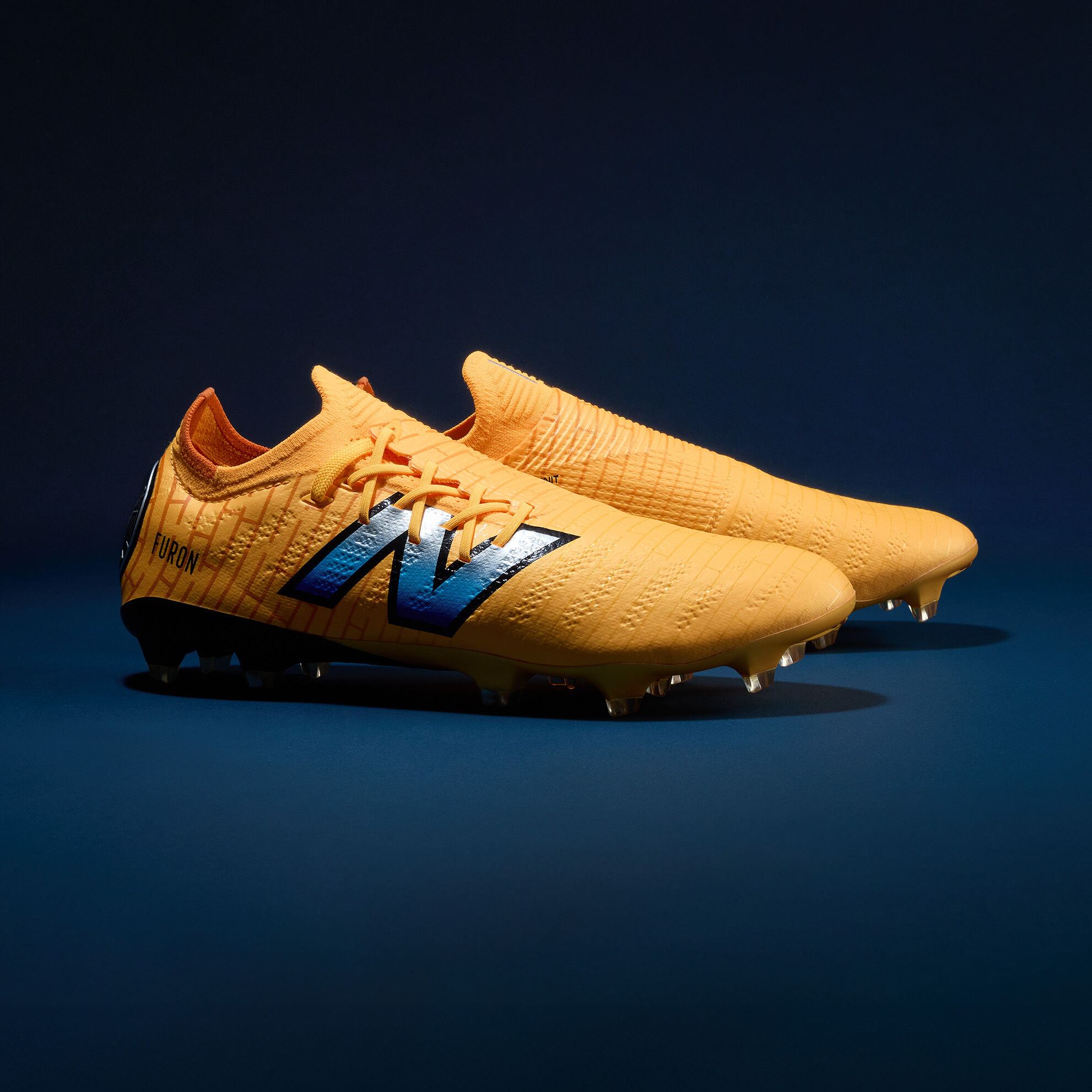 Tacos de futbol New Balance