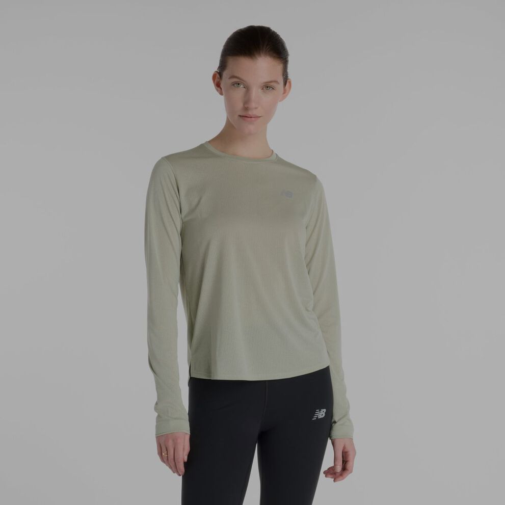 Woman in long sleeve New Balance tee.
