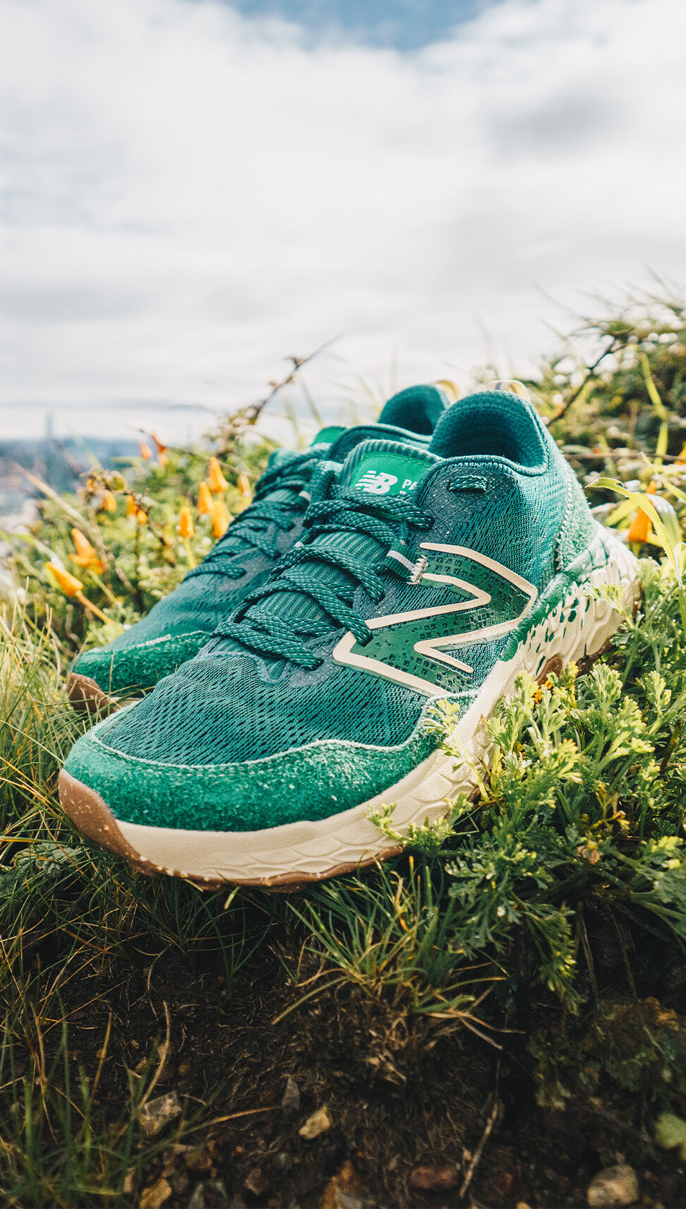 Outdoor detail image of a green pair of Parks Project & NB Fresh Foam X Hierro v7 