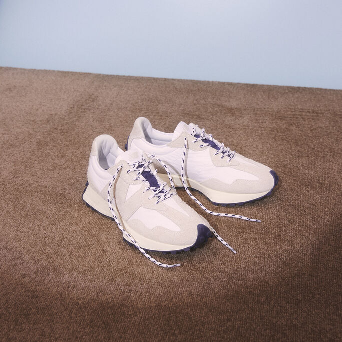 Pair of 327 shoes spotlighted against vintage carpeting.