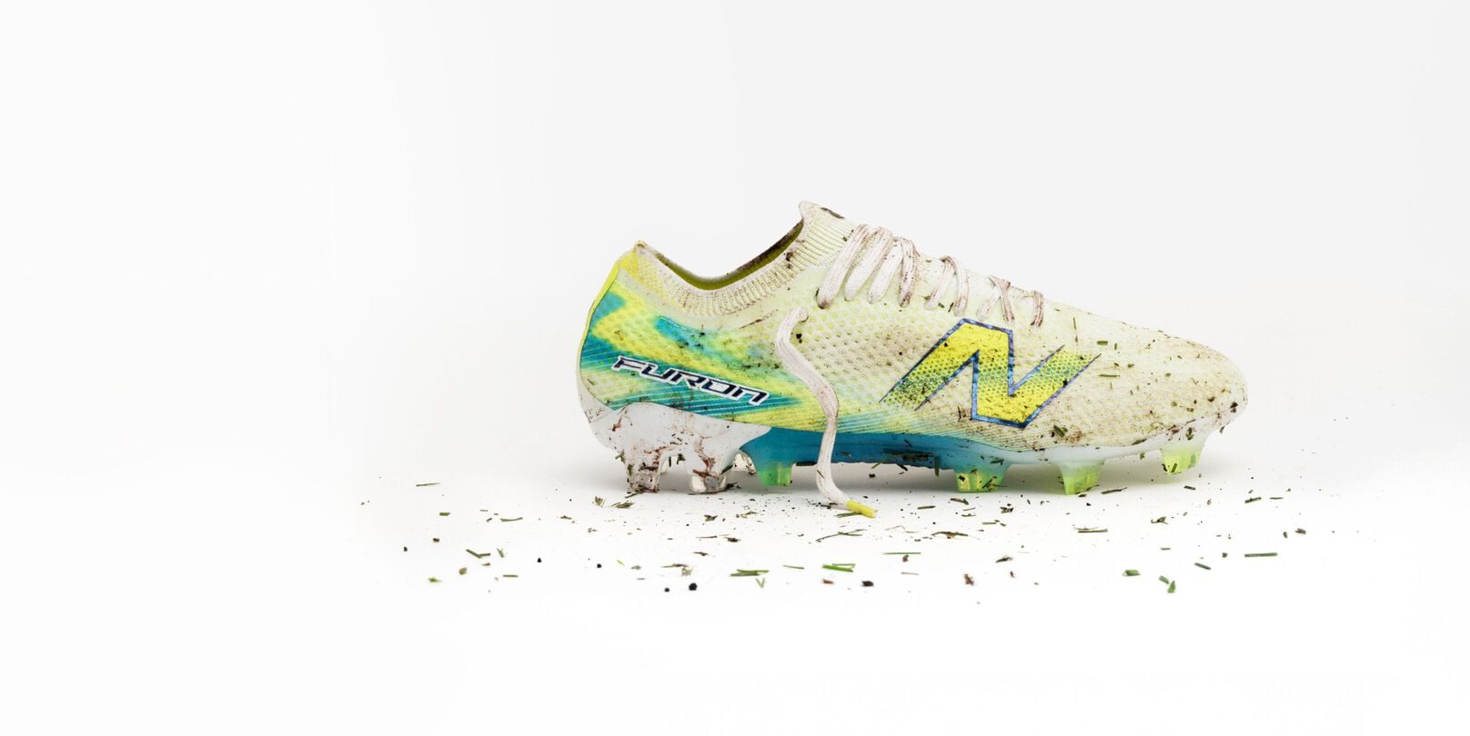 One muddy Furon boot on a white backdrop.