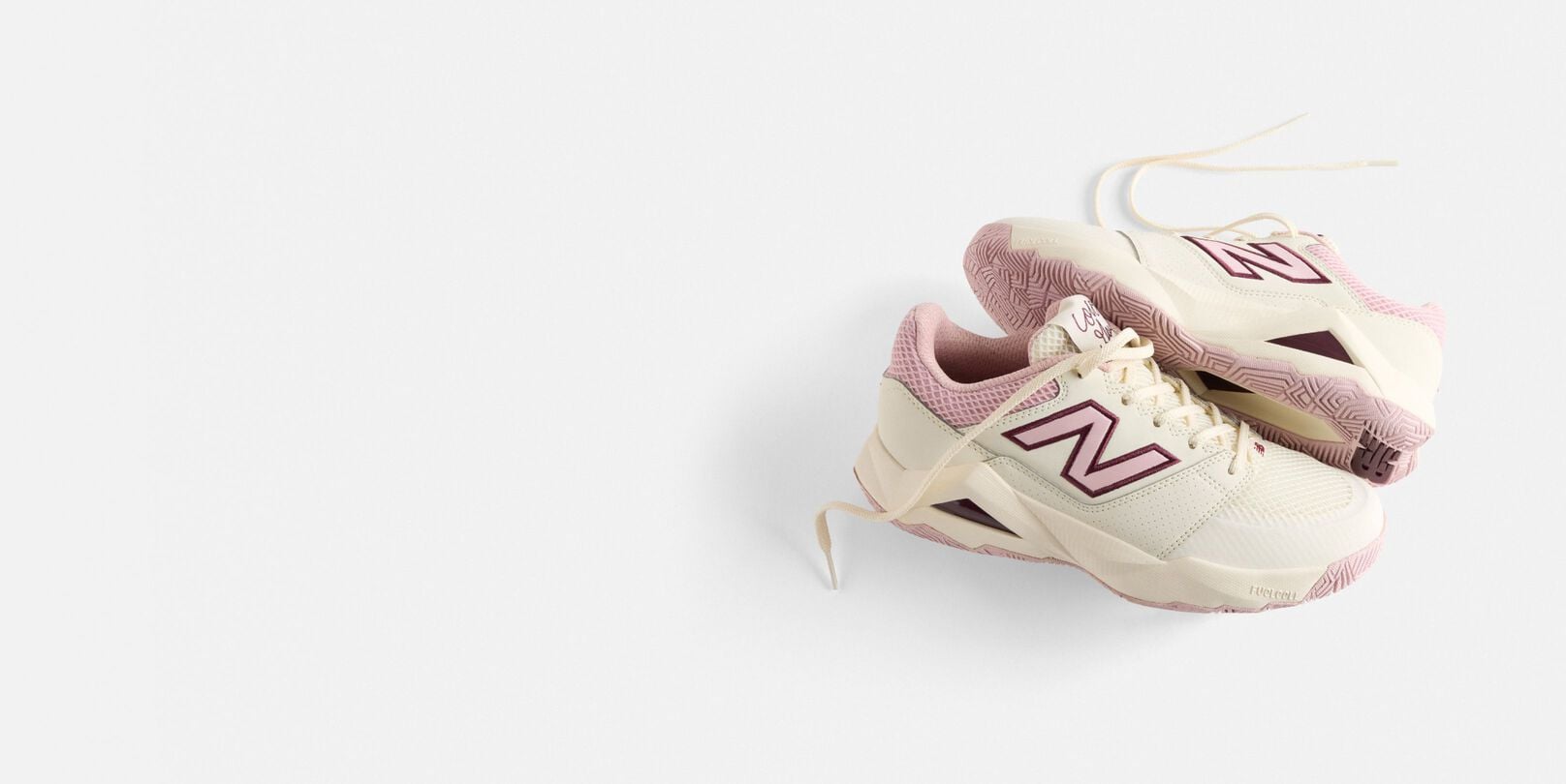 A pair of pink Coco Delray shoes in a studio