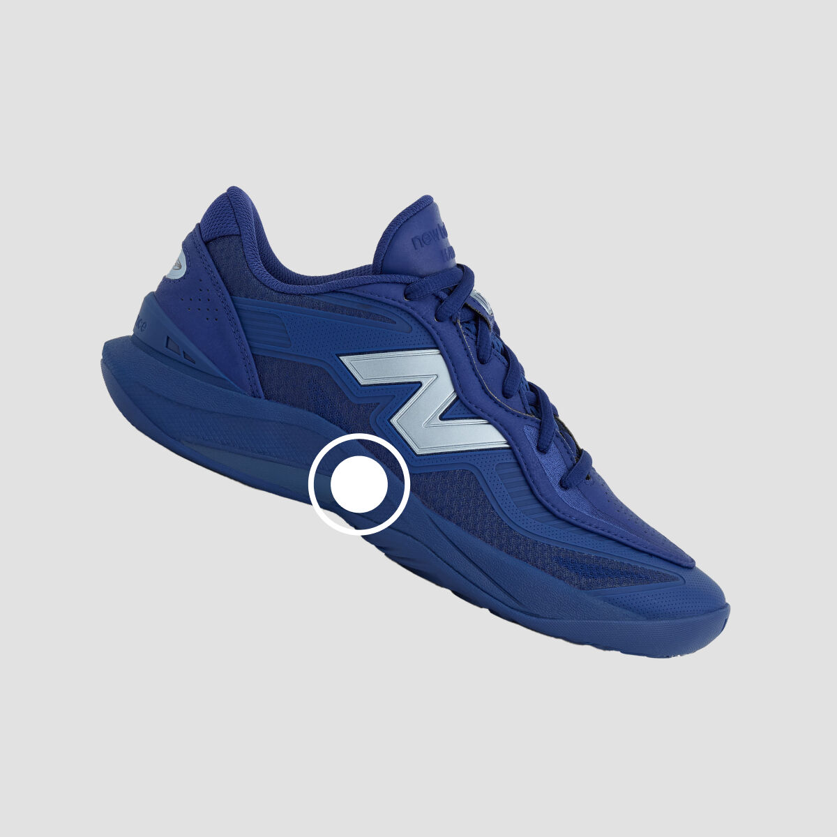 A side angle of a blue athletic sneaker