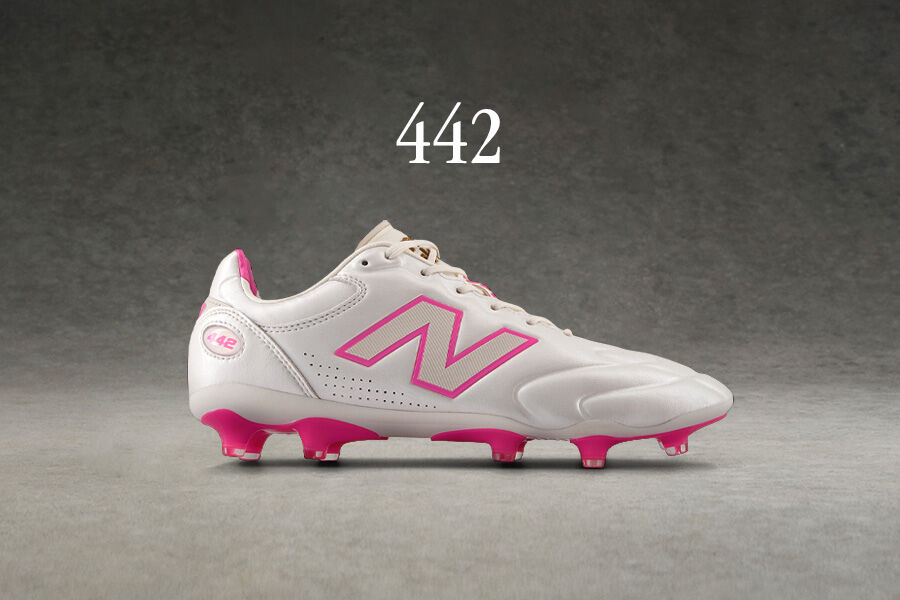 Side view of white 442 soccer cleat.