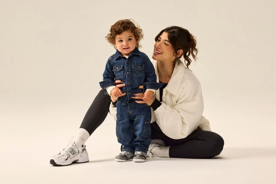 Woman and child wearing NB apparel and shoes.