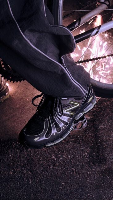 An on-figure knee down shot with the shoes on the pedal of a bike.