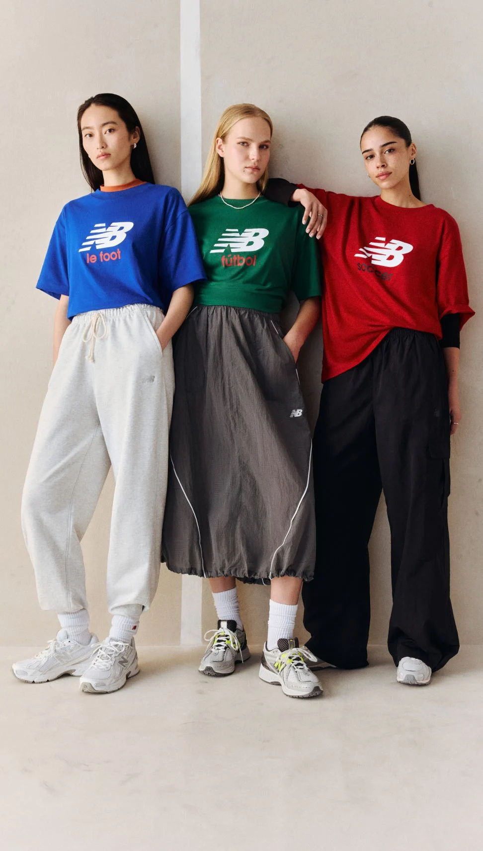 A group of people wearing soccer graphic t-shirts.