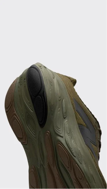 Heel detail of a green Fresh Foam X 1080 shoe.