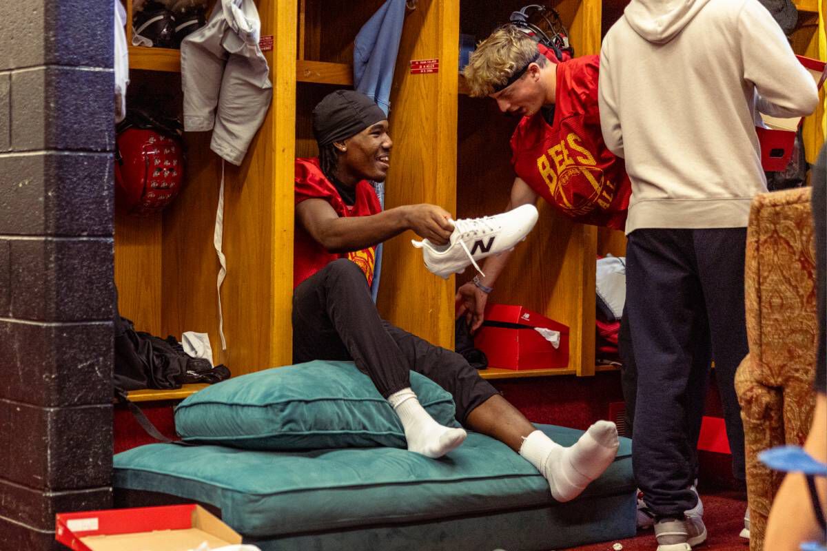 High school football players on a field.