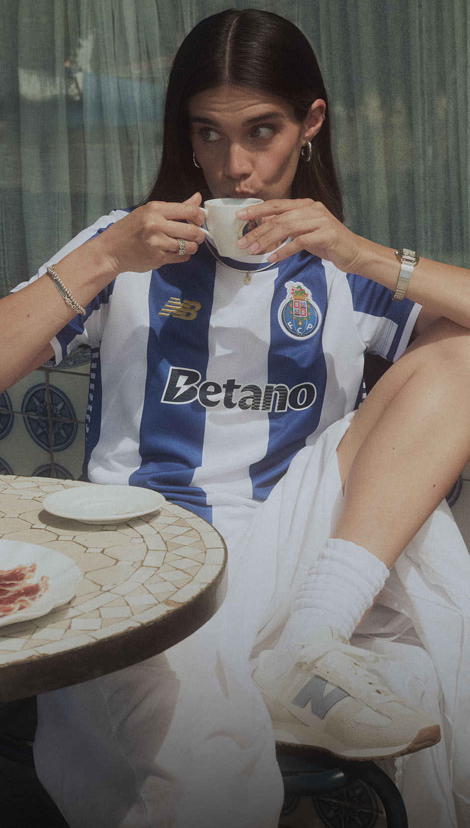Sara Sampaio wearing the FC Porto 2025-26 home kit.    