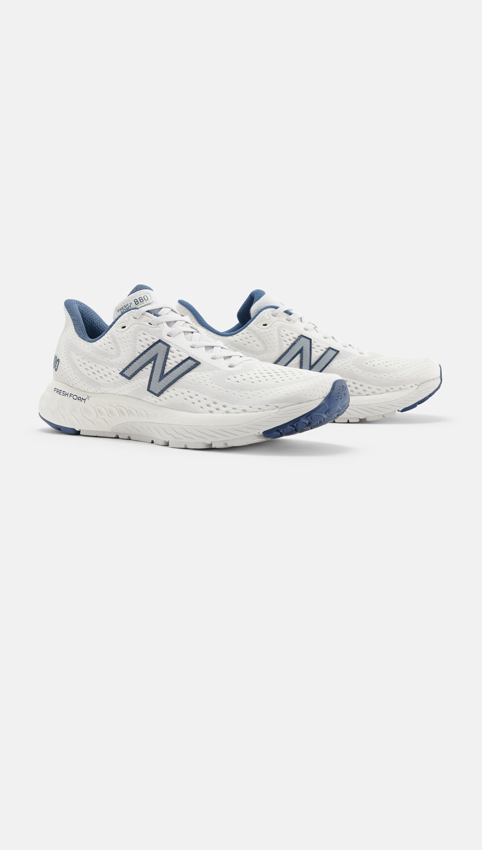 Side view of a pair of white, grey, and blue New Balance Fresh Foam X 880v13s. 