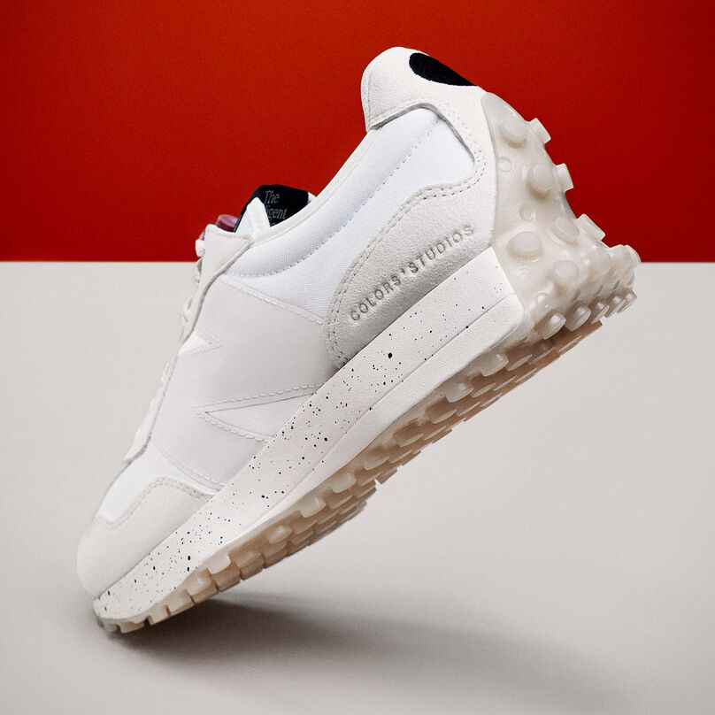 White 327 shoe posed to show detail in heel with the logo COLORSxSTUDIOS debossed into the fabric