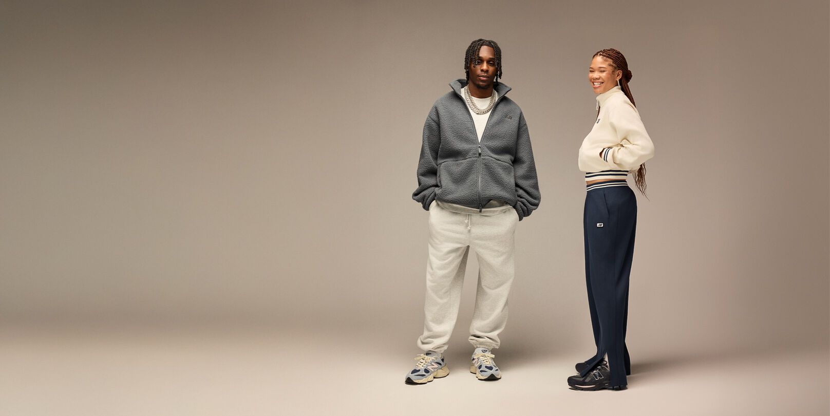 Jeremie Frimpong and Storm Reid posed against beige background 