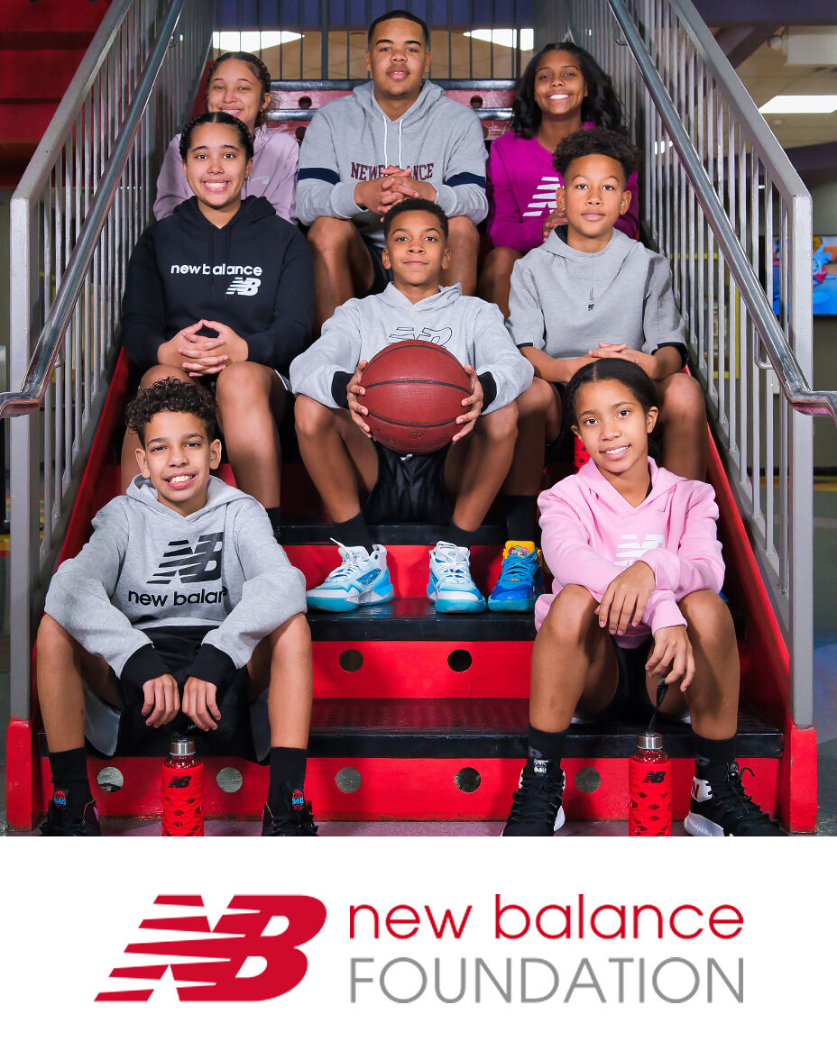 Group of kids posed on staircase in NB gear with New Balance Foundation logo below