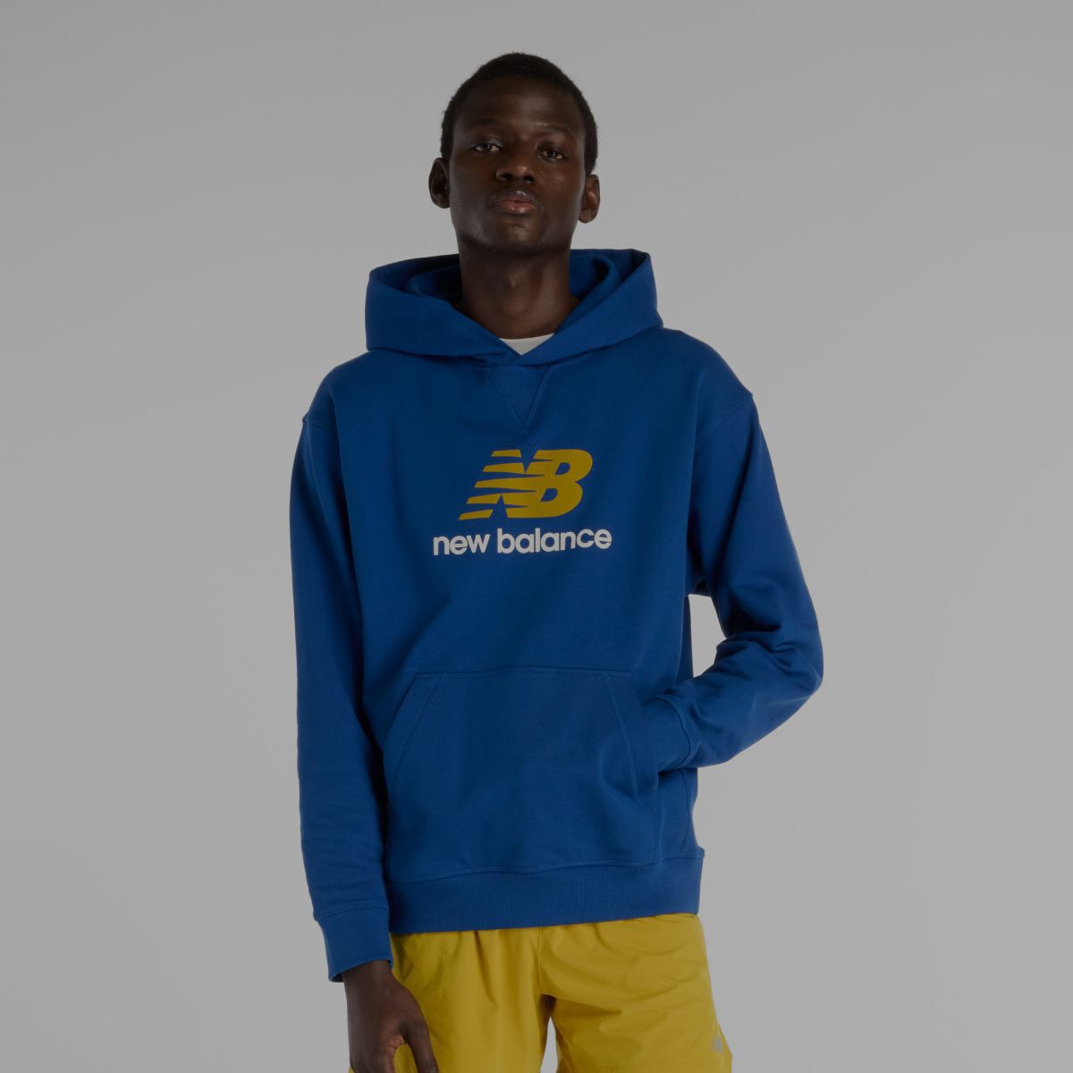A man in a blue New Balance hoodie.