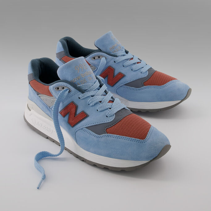 Pair of blue and brown 998 on grey studio background 