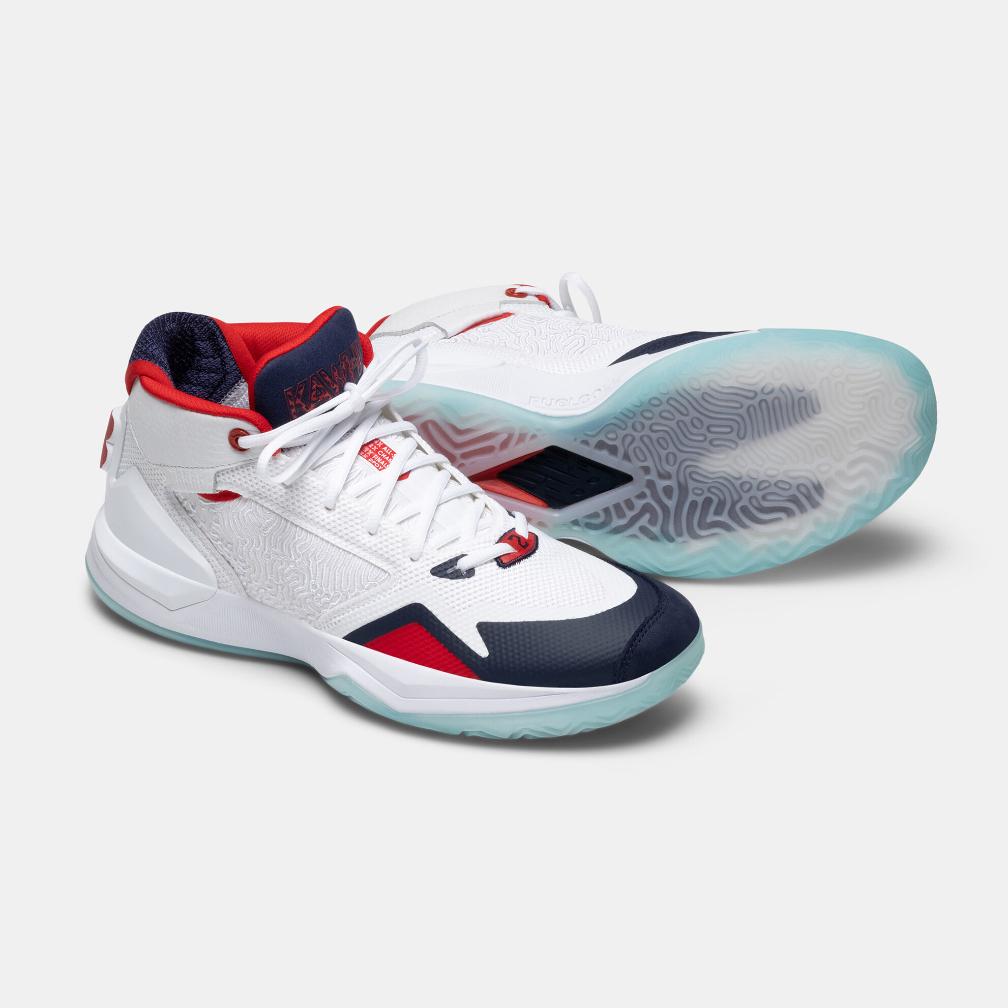 Pair of white KAWHI basketball shoes on a grey background, one angled side profile and one laying on its side with sole showing